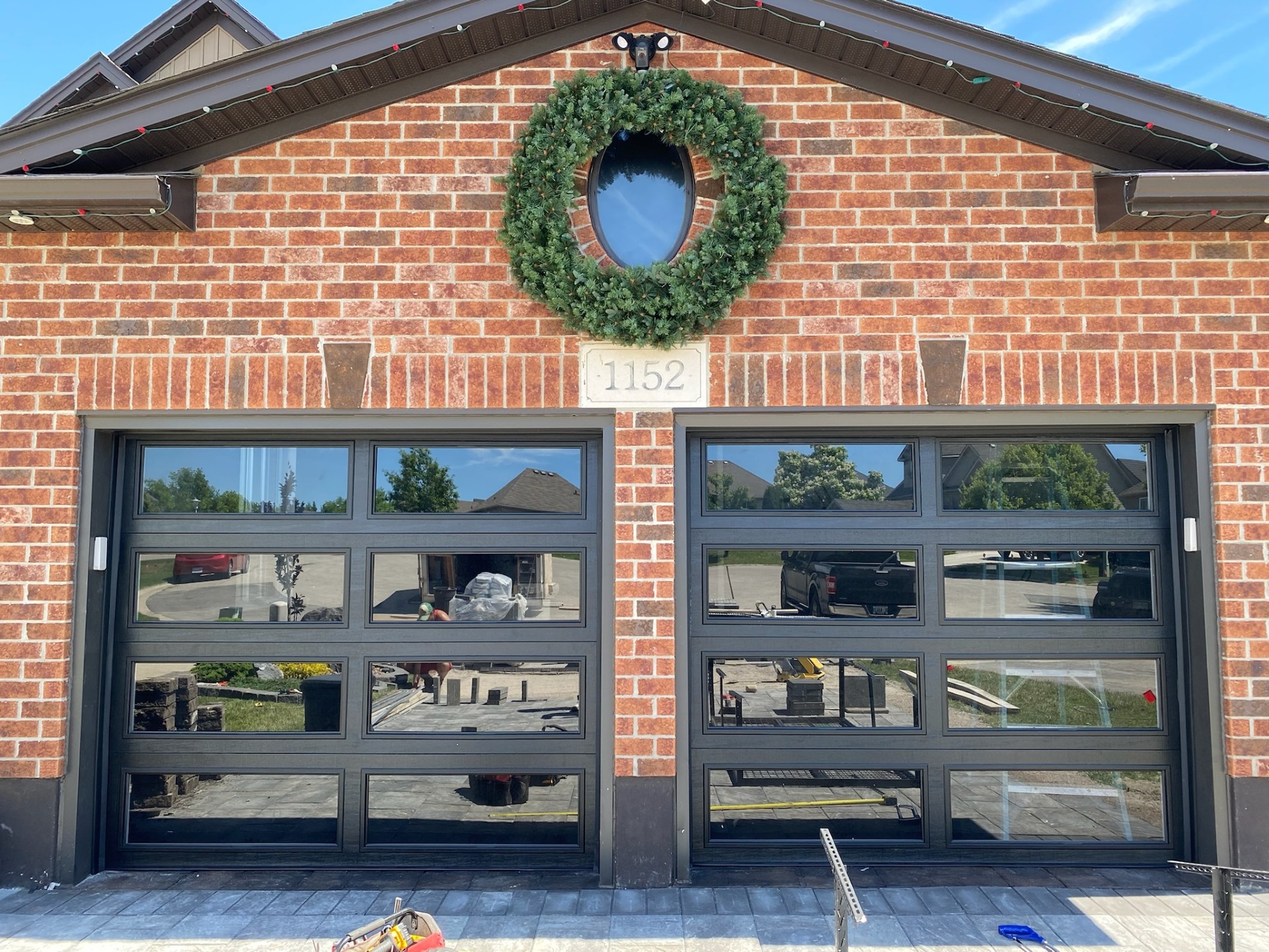 Full-view glass panel garage door installation in Waterloo, Ontario by Discount Garage Doors